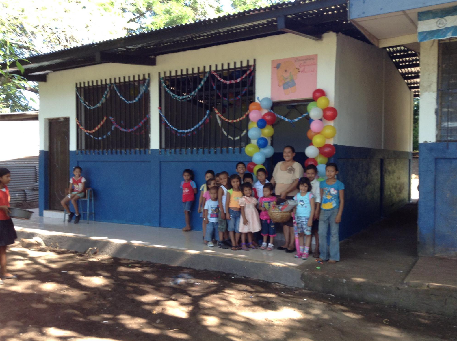Students standing in front of the new pre-school.